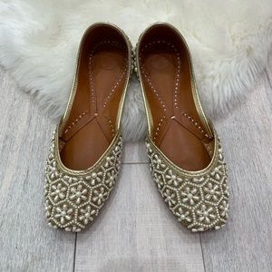 Red Sole Flats in Gold